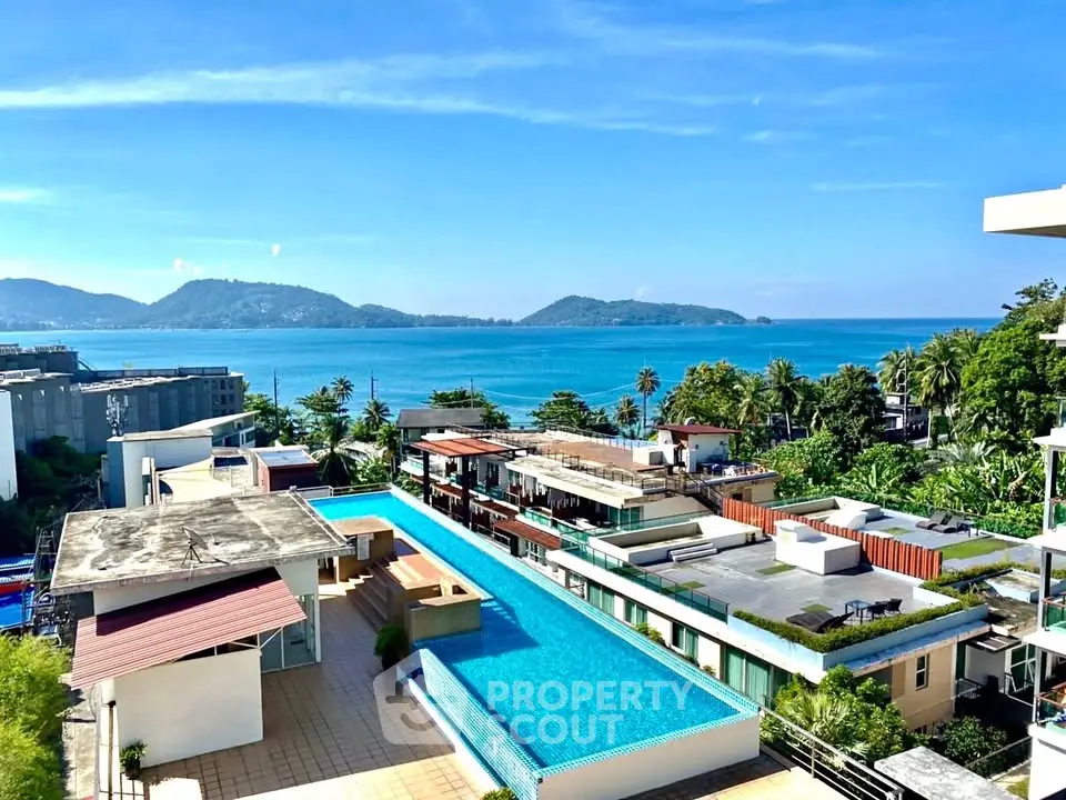 Stunning rooftop pool with breathtaking ocean view in tropical paradise.