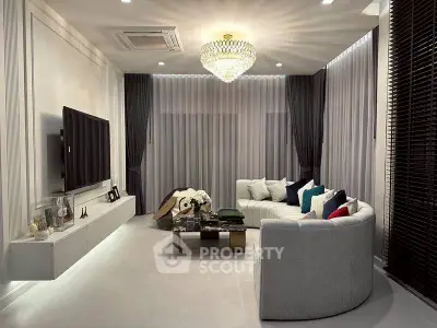 Luxurious living room with modern decor and elegant chandelier