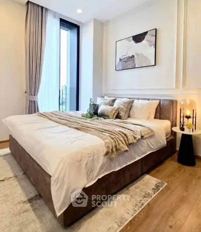 Luxurious bedroom with elegant decor and large window view
