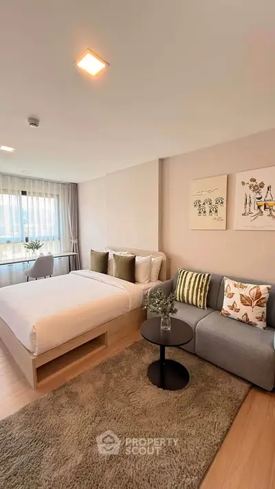 Modern studio apartment with cozy bed and stylish decor