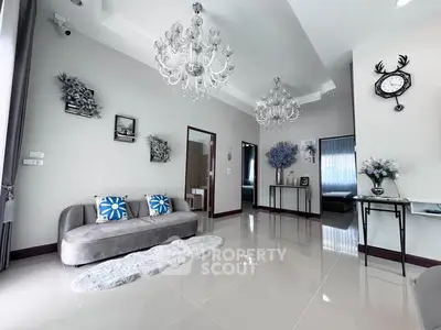 Elegant living room with chandeliers and modern decor in a spacious apartment