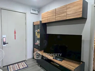 Modern living room with sleek TV unit and stylish wooden cabinets