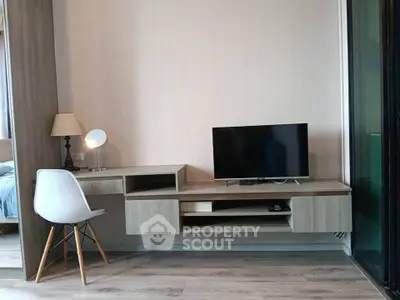 Modern living room with sleek TV stand and stylish chair