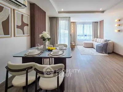 Spacious modern living room with elegant dining area and stylish decor