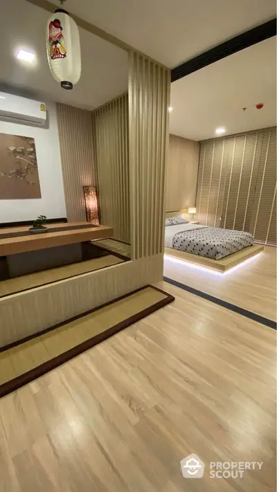 Elegant bedroom with modern Japanese-inspired design and warm wooden accents.