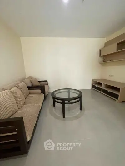 Spacious living room with modern furniture and neutral tones