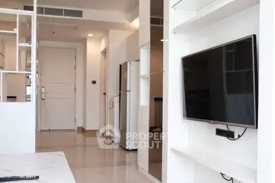 Modern apartment interior with sleek TV and glossy floors