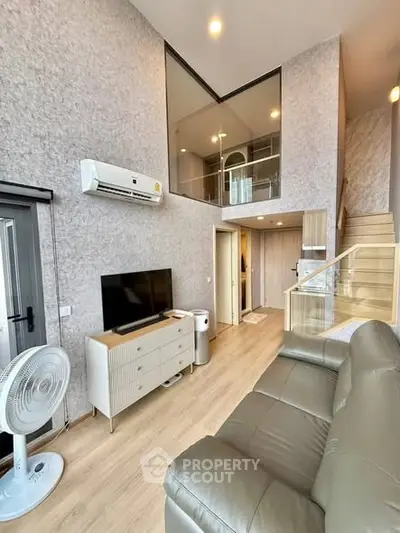 Modern living room with high ceiling and stylish decor