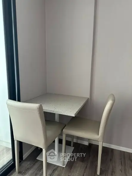 Cozy dining nook with modern table and chairs, perfect for intimate meals.