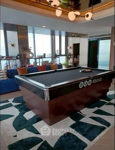 Luxurious living room with billiards table and modern decor