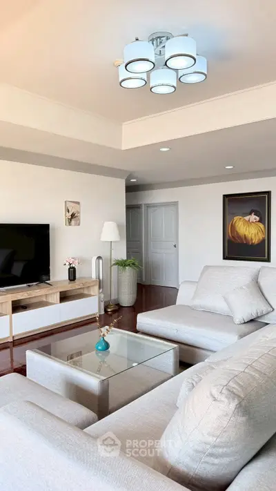 Spacious modern living room with elegant decor and cozy seating area.