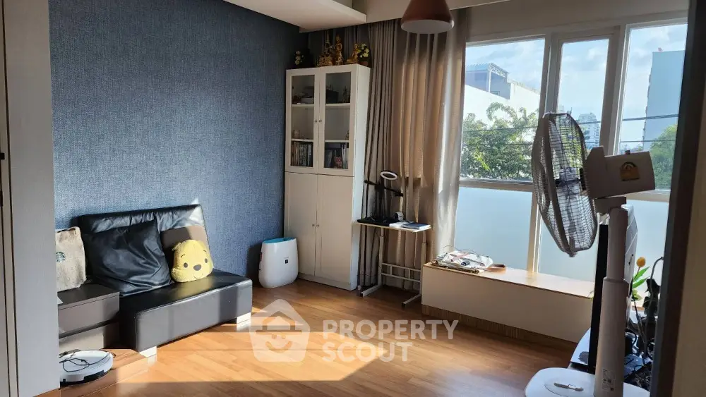 Bright living room with modern decor and large window view