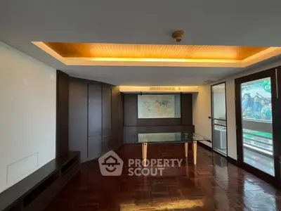 Spacious living room with modern design and large windows offering natural light.