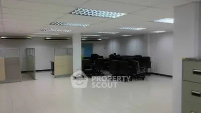 Spacious office interior with modern lighting and ample seating