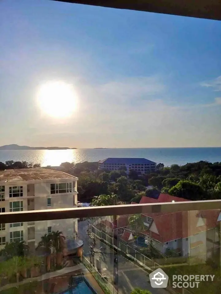 Stunning ocean view from a high-rise balcony with clear skies and serene surroundings.