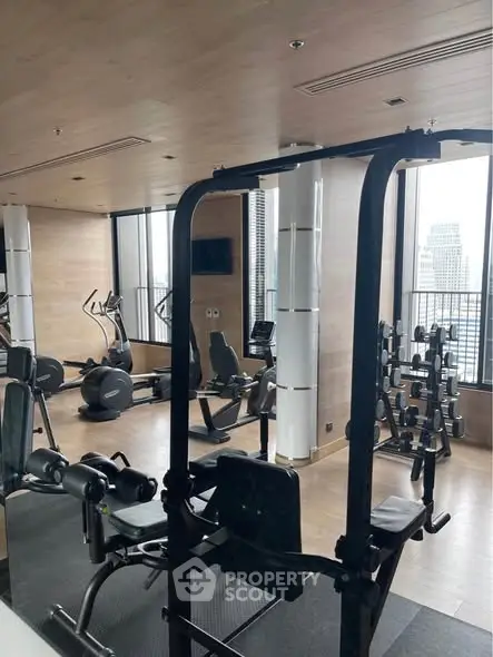 Modern gym with city view in luxury high-rise building