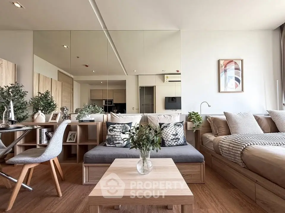 Modern open-plan living room with stylish decor and cozy seating area.