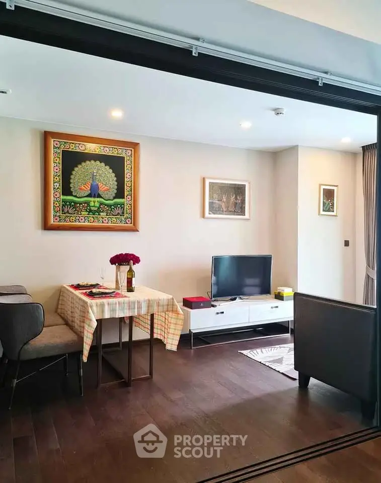 Charming living room with elegant decor and cozy dining area in modern apartment.