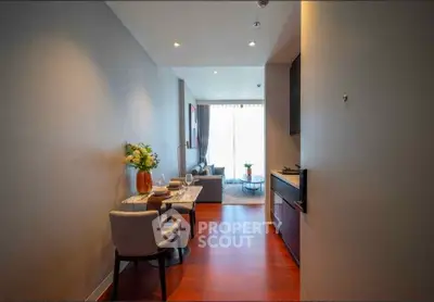 Modern living room with elegant decor and natural light in a stylish apartment.
