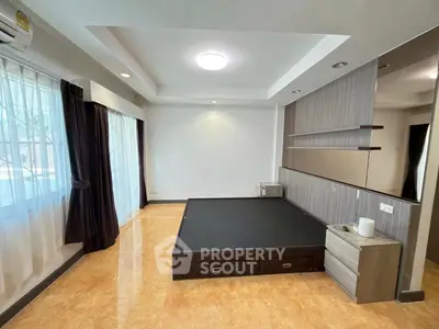 Spacious bedroom with modern design and ample natural light