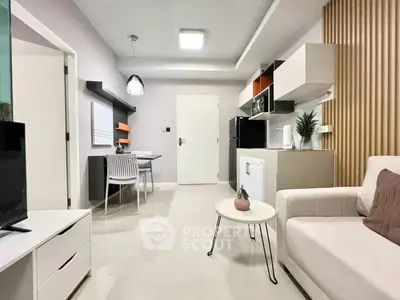 Modern living room with stylish decor and open kitchen layout in a contemporary apartment.