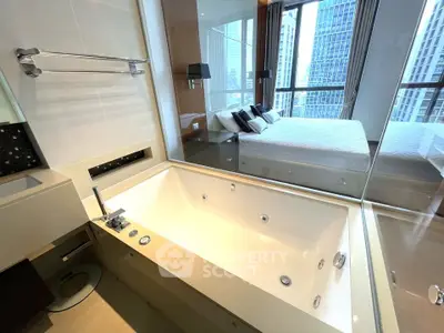 Luxurious modern bathroom with large bathtub and view into elegant bedroom in high-rise apartment.