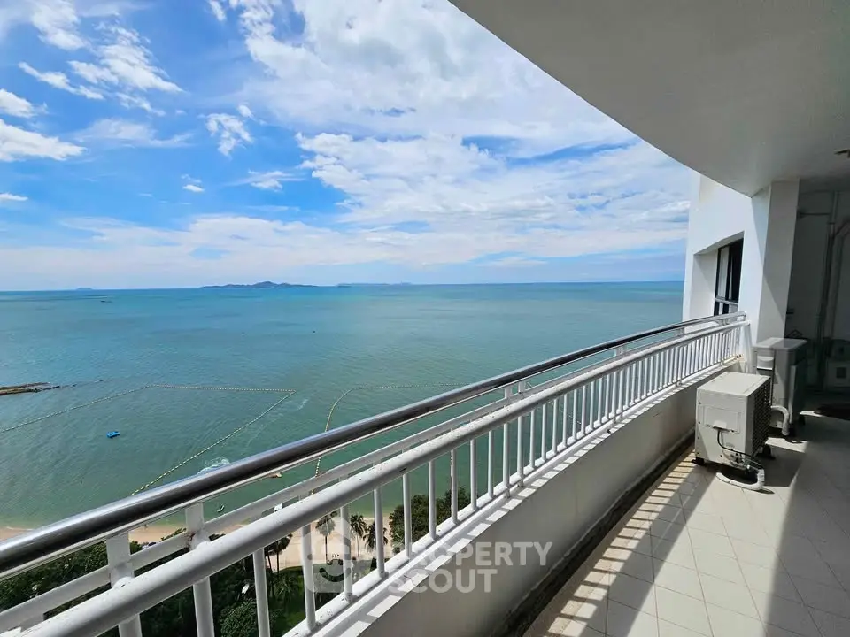 Stunning ocean view from a spacious balcony in a high-rise apartment.