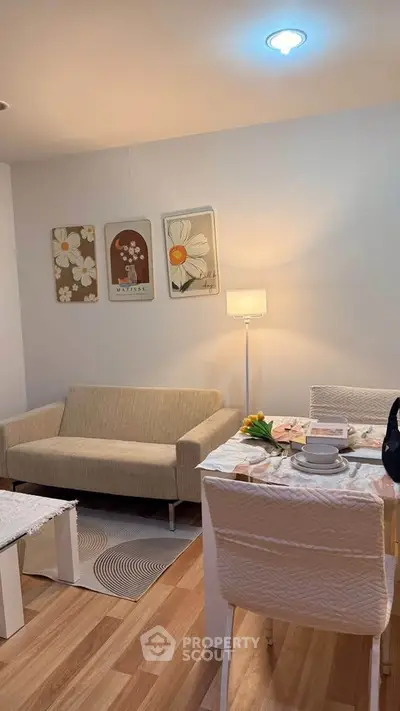 Cozy living room with modern decor and dining area, perfect for relaxation and entertaining.