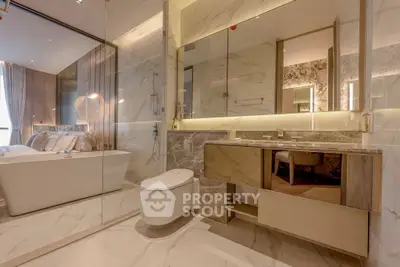 Luxurious modern bathroom with marble finishes and elegant bathtub