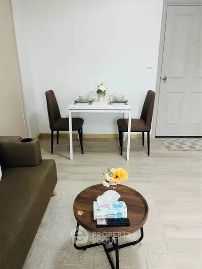 Cozy dining area with modern decor and elegant table setting in a stylish apartment.