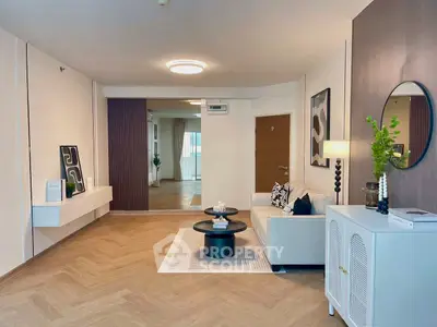 Stylish modern living room with elegant decor and cozy seating area.