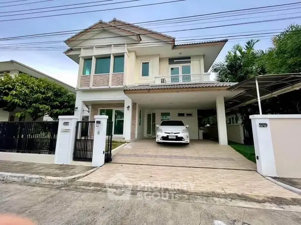 Elegant two-story house with spacious driveway and modern design