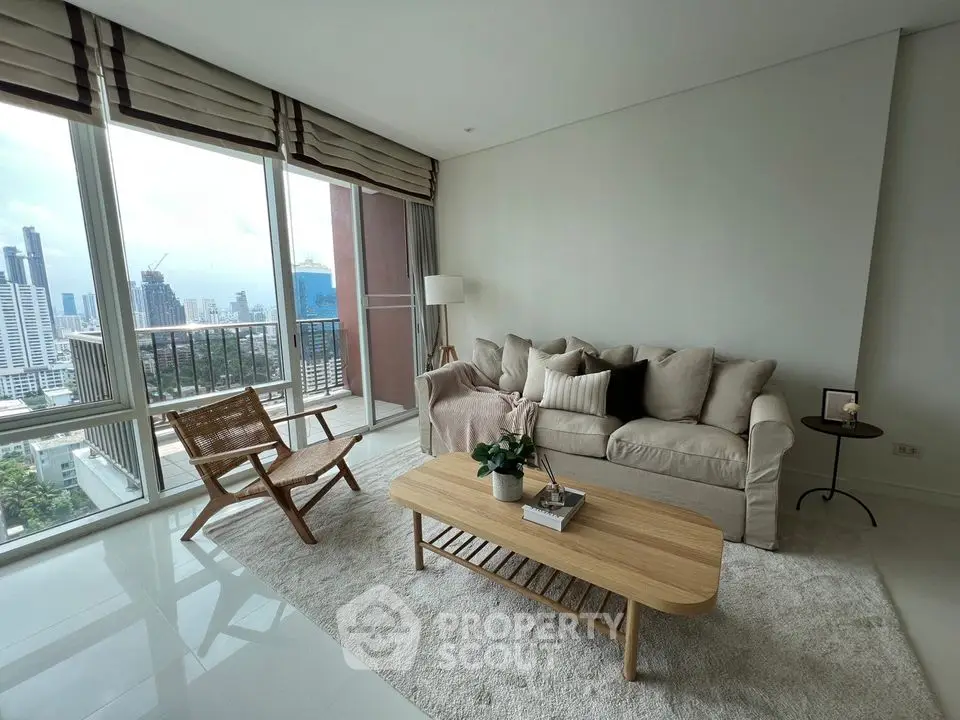 Spacious living room with plush seating, floor-to-ceiling windows, and a serene city view, perfect for urban living.