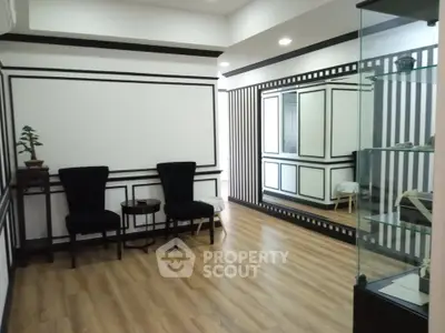 Elegant interior with modern decor and wooden flooring, perfect for stylish living.