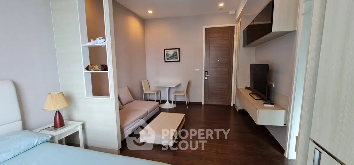 Modern living room with cozy seating and stylish decor in a contemporary apartment.