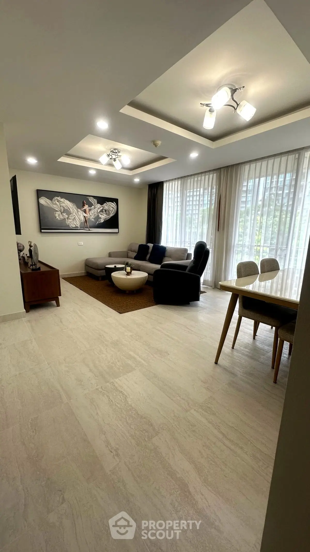 Spacious modern living room with elegant decor and large windows