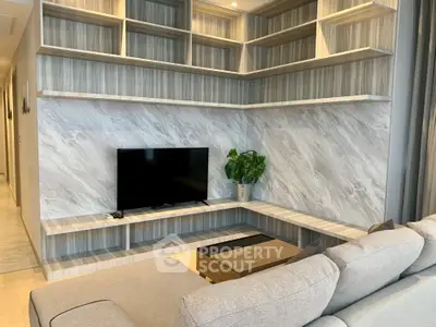 Modern living room with stylish shelving and cozy sectional sofa