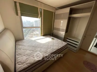 Bright bedroom with city view and built-in wardrobe, perfect for urban living.