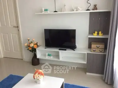 Modern living room with sleek TV stand and decorative shelves