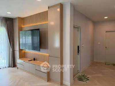 Modern living room with sleek TV unit and elegant decor
