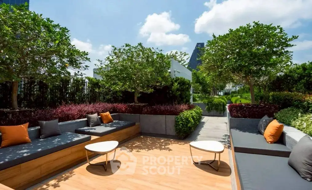Luxurious rooftop garden with stylish seating and lush greenery, perfect for relaxation and entertainment.