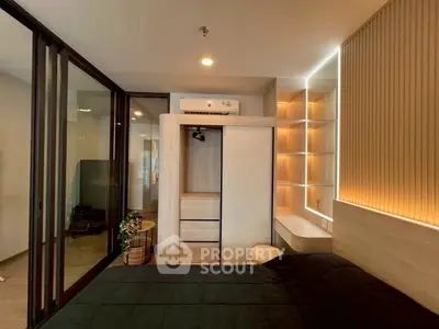 Modern bedroom with sleek design, built-in wardrobe, and ambient lighting for a cozy atmosphere.