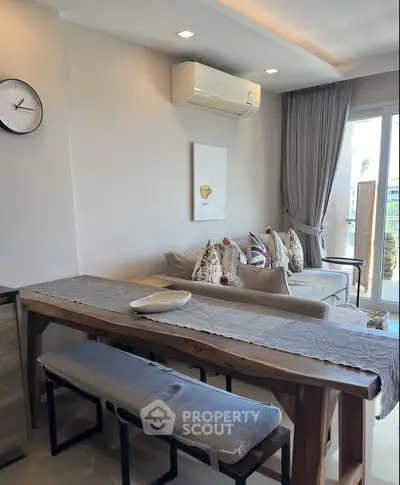 Chic living room with modern decor and natural light, perfect for relaxation and entertaining.