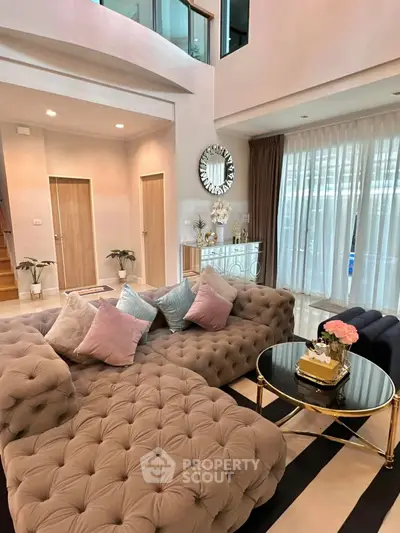 Luxurious living room with plush sofa and elegant decor in modern home