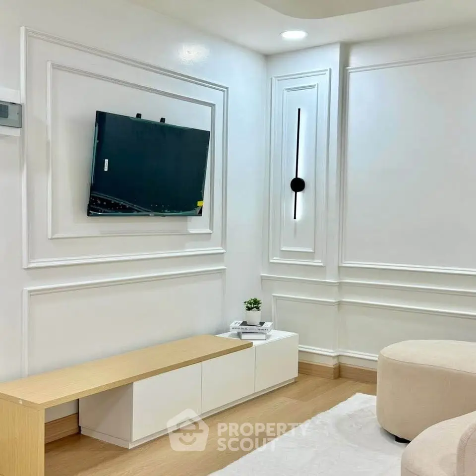 Modern living room with elegant wall paneling and minimalist decor