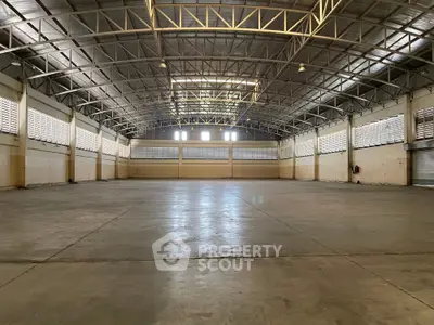 Spacious industrial warehouse with high ceilings and ample natural light