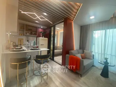 Modern open-plan living room and kitchen with stylish decor and cozy ambiance