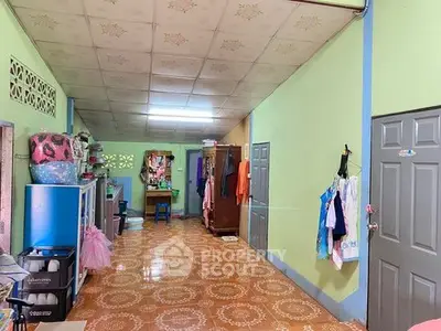 Spacious interior hallway with colorful decor and ample storage space.