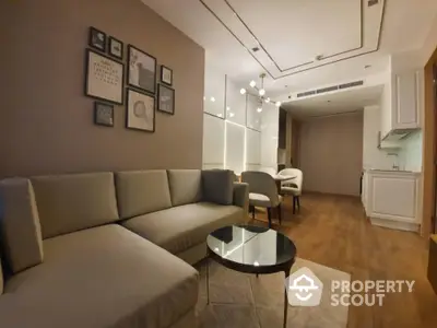 Modern living room with cozy sectional sofa and elegant dining area in open layout apartment.