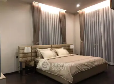 Luxurious bedroom with elegant curtains and modern decor